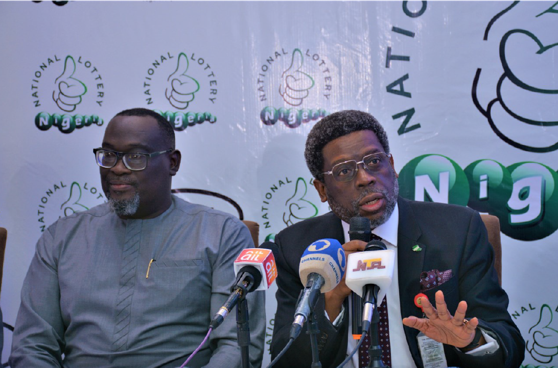 NLRC DG, MR. Lanre Gbajabiamila (right) with the MD of National Lottery Mr Layi Onafowokan during the launch in Abuja